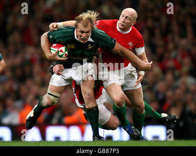 South Africa's Schalk Burger is tackled by Wales Tom Shanklin during the Invesco Perpetual Autumn Series match at the Millennium Stadium, Cardiff. Stock Photo