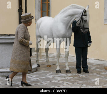 Britain's Queen Elizabeth II with a Lipizzaner horse at the Lipica Stud during a state visit to Slovenia. Stock Photo