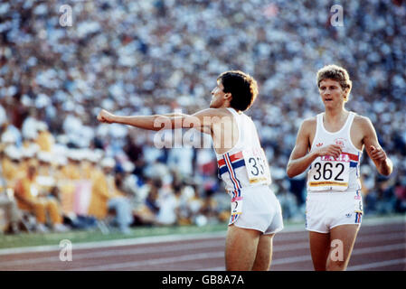 Great Britain's Seb Coe (l) gestures towards the press box after winning gold as teammate Steve Cram (r) walks over to congratulate him. The British press had criticized the decision to select Coe for the Olympic team, as his fitness in the months before the Games had not been up to scratch and they considered he would not get near the medals Stock Photo