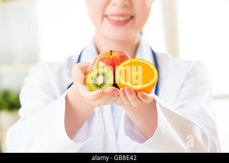 Young asian nutritionist holding  diet and healthy food, healthcare Stock Photo