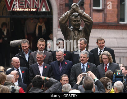 Former football players gather around a statue to Nottingham Forest's legendary manager Brian Clough as it is unveiled by his widow Barbara in the city's Old Market Square area. Stock Photo