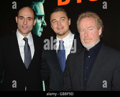 Leonardo DiCaprio, (centre), with director Ridley Scott, (right), and British actor Mark Strong, (left), at the UK film premiere of 'Body of Lies' at the Vue West End, in central London. Stock Photo