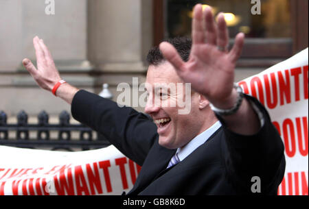 Teacher and British National Party member Adam Walker, from Houghton Kepier Sports College near Sunderland, is greeted by supporters outside a General Teaching Council hearing in Birmingham, where he was accused of religious intolerance while contributing to a right-wing website. Stock Photo