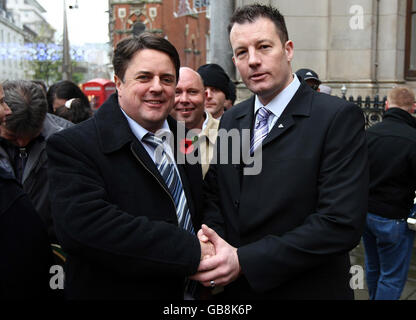 Teacher and British National Party member Adam Walker (right), from Houghton Kepier Sports College near Sunderland, shakes hands with BNP chairman Nick Griffin outside a General Teaching Council hearing in Birmingham, where Mr Walker is accused of religious intolerance while contributing to a right-wing website. Stock Photo