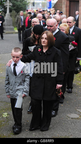 Michael Lappin and Toni Lappin brother and mother of murdered Joseph Lappin lead mourners from church followed by sister Bethany Lappin and father John Lappin after the funeral service for Joseph at St Oswald's Church, Old Swan, Liverpool. Stock Photo