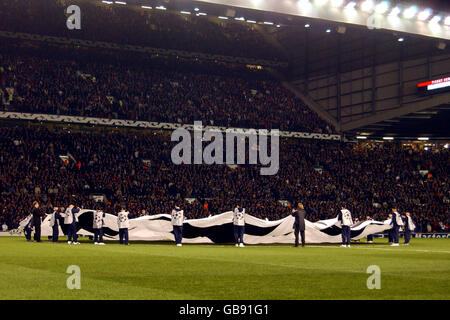 Soccer - UEFA Champions League - Group E - Manchester United v Rangers. The ball girls and boys lift the giant starball logo Stock Photo