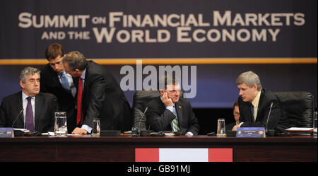 Prime Minister Gordon Brown, left, at the first session of the Summit on Financial Markets and the World Economy alongside Canadian PM Stephen Harper (far right) and Canadian Finance Minister Jim Flaherty, during the G20 economic crisis summit in Washington. Stock Photo