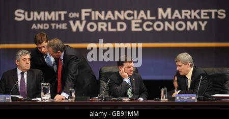 Prime Minister Gordon Brown, left, at the first session of the Summit on Financial Markets and the World Economy, with Canadian PM Stephen Harper (far right) and Canadian Finance Minister Jim Flaherty, during the G20 economic crisis summit in Washington. Stock Photo