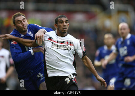 Soccer - Coca-Cola Football Championship - Birmingham City v Charlton Athletic - St Andrews. Charlton's Hammeur Bouazza competes with Birmingham's Nicky Hunt during the Coca-Cola Football Championship match at St Andrews, Birmingham. Stock Photo