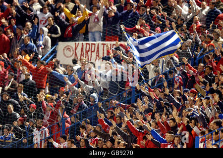 Soccer - UEFA Champions League - Group D - Olympiakos v Galatasaray. Olympiakos fans urge their team on to victory against Galatasaray Stock Photo