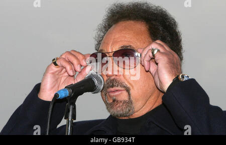 Singer Tom Jones is seen busking on the South Bank for part of BBC2's Culture Show 'British Busking Challenge' in central London. Stock Photo
