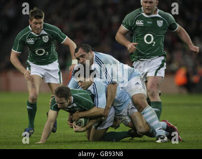 Ireland's Tomas O'Leary is brought down by Argentina's Nicolas Vergallo during the Guinness Series 2008 match at Croke Park, Dublin, Ireland. Stock Photo