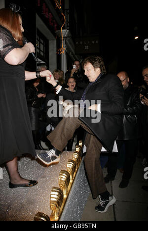 Sir Paul McCartney joins Peter Kay for the switching on of the Christmas lights at Stella McCartney's store in Mayfair, central London. Stock Photo