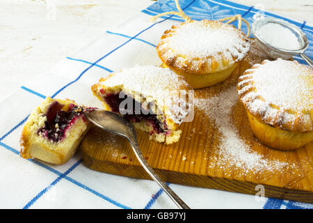 Small confiture pie, close up. Small pie. Pie. Jam pie. Sweet dessert. Sweet pastry. Stock Photo