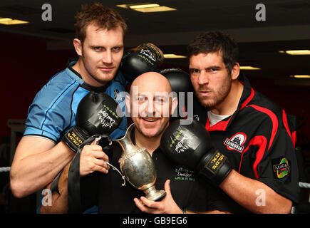 Glasgow Warriors captain Alastair Kellock (left) with Edinburgh's Jim Hamilton and David Lloyd manager Donny Doyle (centre) posing in a boxing ring at the David Lloyd Centre, Glasgow. Stock Photo