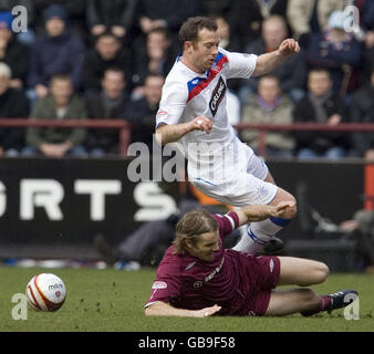 Rangers midfielder Charlie Adam (above) is tackled by Hearts defender Robbie Neilson during the Clydesdale Bank Premier League match at Tynecastle Stadium, Edinburgh. Stock Photo