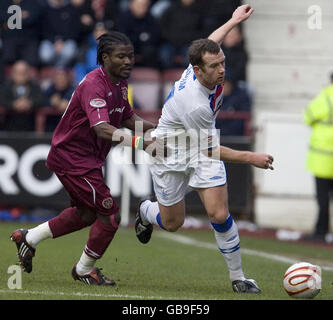 Rangers' Charlie Adam (right) and Hearts' Laryea Kingston battle for the ball during the Clydesdale Bank Premier League match at Tynecastle Stadium, Edinburgh. Stock Photo