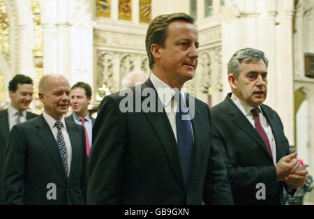 Britain's Prime Minister Gordon Brown (right) walks with opposition Conservative Party leader David Cameron in the Peers Lobby of the Houses of Parliament during the State Opening of Parliament, London. Stock Photo