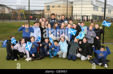 Scotland's Chris Paterson and Ross Ford pose for photographs with the children during the community day at Kintore Primary School Stock Photo