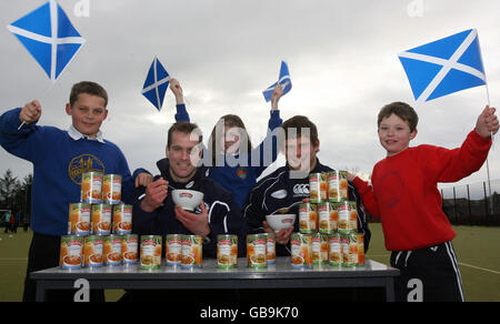 Rugby Union - Scottish Rugby Union Community Day - Kintore Primary School. Scotland's Chris Paterson and Ross Ford pose with Baxters Soup tins during the Community Day at Kintore Primary School Stock Photo