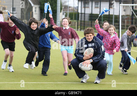 Scotland's Ross Ford coaches the children during the community day at Kintore Primary School Stock Photo