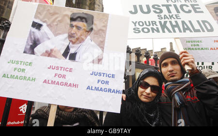 Aisha Al Megrahi, wife of the Lockerbie bomber Adbeldbaset Ali Mohmed Al Megrahi with his son Khalid during a candle-lit vigil to highlight alleged miscarriages of justice outside the Scottish Parliament in Edinburgh. Stock Photo