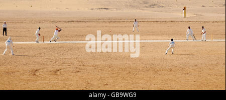 Local cricket teams play a match in the desert outside the Sheikh Zayed Stadium in Abu Dhabi, United Arab Emirates. PRESS ASSOCIATION Photo, Friday December 5 2008. Photo credit should read: Anthony Devlin/PA Wire. Stock Photo