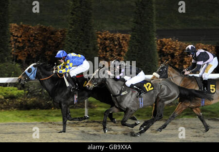 Bookiesindex Boy, ridden by Darryll Holland wins The AFM Services Data Centre Construction Handicap Stakes at Kempton Park Racecourse, London. Stock Photo