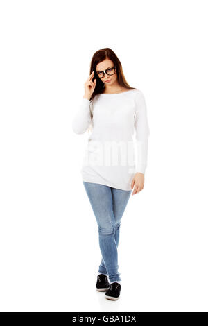 Young woman holding her glasses Stock Photo