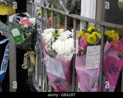 Close up view of tributes left outside the Queen Anne Hotel on Market Street in Heywood, Greater Manchester, following the death of Emma O'Kane, 27, who was hit in the neck by a shard of glass. Stock Photo