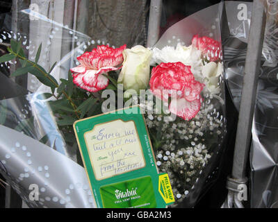 Close up view of tributes left outside the Queen Anne Hotel on Market Street in Heywood, Greater Manchester, following the death of Emma O'Kane, 27, who was hit in the neck by a shard of glass. Stock Photo