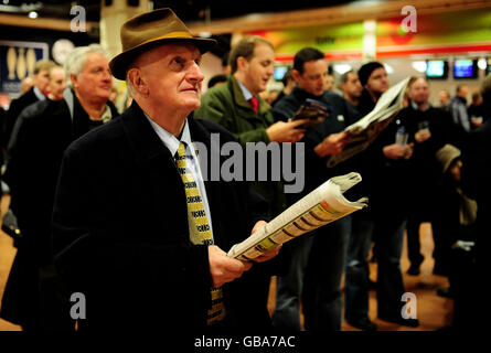 Former trainer Martin Pipe pictured watching the races at Sandown Park race course. Stock Photo