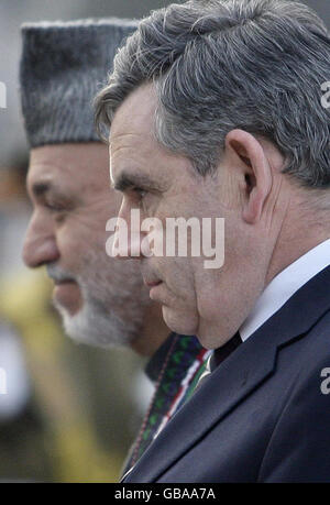 Prime Minister Gordon Brown and Afghan President Hamid Karzai, arrive for a press conference in Kabul, Afghanistan during Mr. Brown's surprise visit to the area. Stock Photo