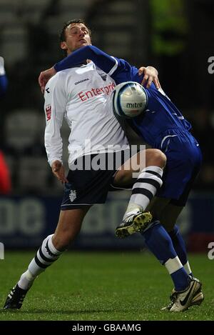 Preston's Chris Brown and Birmingham City's Liam Ridgewell (right) battle for the ball Stock Photo