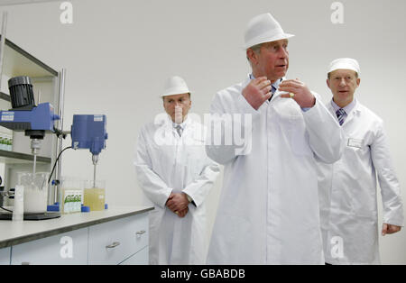 The Prince of Wales (centre) talks to workers during a visit to Nelsons' natural healthcare manufacturing factory in Wimbledon, London. Stock Photo