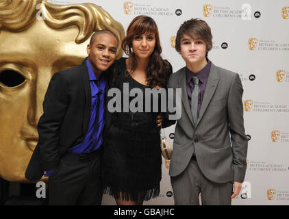 (left - right) Danny Anthony, Anjli Mohindra and Tommy Knight arrive at the EA BAFTA Kids Awards at the Hilton Hotel in London. Stock Photo