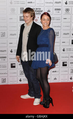 Alfie Allen (left) and Jaime Winstone arrive for the British Independent Film Awards at Old Billingsgate Market, east London. Stock Photo