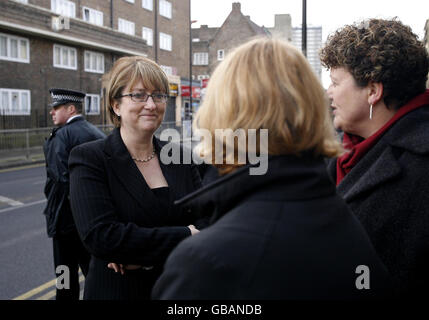 Home Secretary Jacqui Smith speaks with local councillors during a visit to a house closed under new behaviour orders, in Tower Hamlets, east London. Stock Photo