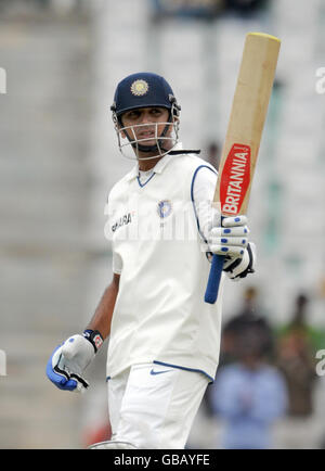 Rahul Dravid celebrates scoring a half century during the first day of the second test at the Punjab Cricket Association Stadium, Mohali, India. Stock Photo