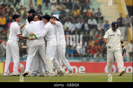 England's Graeme Swann is congratulated after taking the wicket of Sachin Tendulkar, lbw for 11 during the second day of the second test at the Punjab Cricket Association Stadium, Mohali, India. Stock Photo