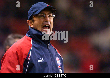 Stoke City Manager Tony Pulis shouts as he sees his team win their second game in four days Stock Photo
