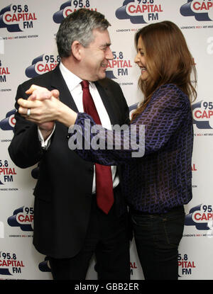 Prime Minister Gordon Brown meets Capital FM presenter Lisa Snowdon during his visit to open the Headquarters of Global Radio in Leicester Square, central London. Stock Photo