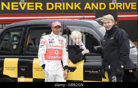 Retired Formula 1 World Champion Mika Hakkinen (right) and current Formula 1 World Champion Lewis Hamilton (left) join Mayor of London Boris Johnson in backing an anti-drink-drive campaign at Potters Fields Park in London. Stock Photo