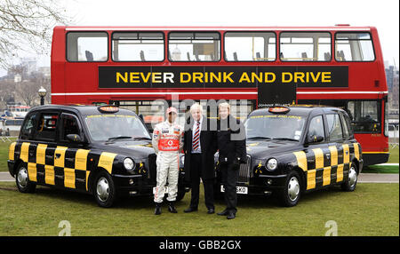 Retired Formula 1 World Champion Mika Hakkinen (right) and current Formula 1 World Champion Lewis Hamilton (left) join Mayor of London Boris Johnson in backing an anti-drink-drive campaign at Potters Fields Park in London. Stock Photo