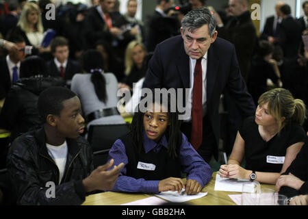 Prime Minister Gordon Brown and former EastEnders soap opera actress Brooke Kinsella, right, whose 16-year-old brother Ben was stabbed to death earlier this year, listen as local youngsters talk during the launch of the 'No To Knives' campaign in London. Stock Photo