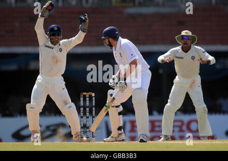 India's MS Dhoni celebrates after catching England's Steve Harmison, off the bowling of Yuvraj Singh for 6 during the second day of the First Test Match at the M. A. Chidambaram Stadium in Chennai, India. Stock Photo