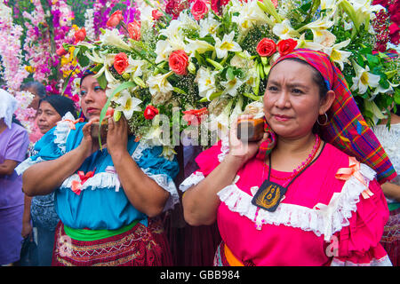 Salvadorian women participate in the procession of the Flower & Palm Festival in Panchimalco, El Salvador Stock Photo