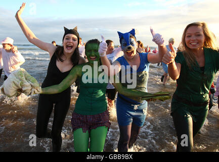 Swimmers in the sea at the Aberdeen Lions Club Nippy Dipper Boxing Day dip into the North Sea at Aberdeen Beach. Stock Photo