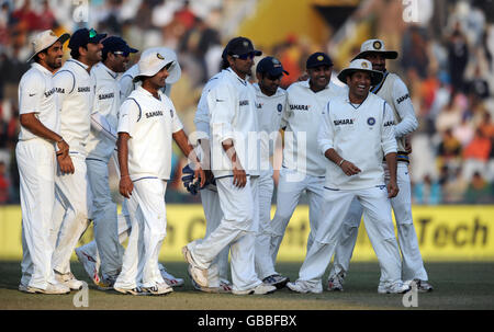 Indian players leave the field following the close of play on the fifth day of the second test at the Punjab Cricket Association Stadium, Mohali, India. Stock Photo