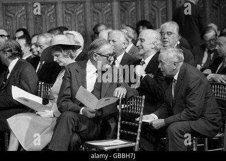 Conservative Party leader Margaret Thatcher sits at left while Prime Minister James Callaghan is engaged in conservation with Sir Harold Wilson, right, before being addressed by President Valery Giscard d'Estaing of France. Stock Photo